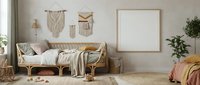 Cozy boho living room interior with rattan daybed, macrame wall hangings, neutral textiles, plants and blank frame for mockup design projects.