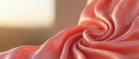 Luxurious coral pink silk fabric with elegant flowing folds and soft texture, perfect for fashion design, textile backgrounds, and premium material concepts.