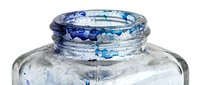 Close-up of an open glass jar with blue metallic lid showing wear, rust, and weathered patina. Suitable for vintage, antique, recycling, and sustainability concepts.