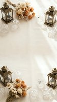 Autumn Halloween flat lay with bronze lanterns, dried flowers, white ghost decorations and crystal glasses on neutral background with copy space.