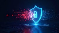 Glowing blue cybersecurity shield with lock symbol protecting against red digital attack particles on dark futuristic background for data protection concepts.