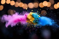 Vibrant explosion of pink, gold and blue powder paint with bokeh lights in background creates dynamic motion effect for creative and artistic designs.