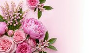 Pink roses and peonies with lily of the valley flowers arranged on soft pink background with copy space for romantic wedding or Mother's Day greeting cards.