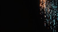 Glowing digital rain with orange and blue binary code falling on black background, creating cybersecurity and technology concept visualization.