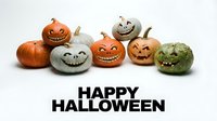 Spooky carved pumpkins and gourds with jack-o-lantern faces arranged in a row on white background for seasonal holiday decorations and festive designs.