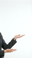Woman in dark business suit with hands gesturing upward in presenting or measuring motion against white background for corporate communication.