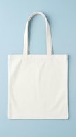 Blank cream cotton tote bag with long handles isolated on light blue background, ready for custom design, branding, printing, and merchandise applications.
