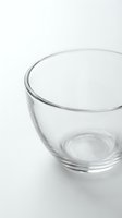 Empty clear glass bowl on white background for kitchen cooking baking food preparation and serving tableware design projects.