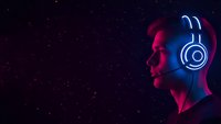 Young man with glowing neon headphones in profile against starry night sky background with blue and pink lighting effects for music and technology concepts.