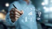Business person drawing creative strategy and innovation sketches with white marker, showing growth charts, ideas and business planning concepts.