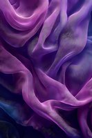 Flowing purple silk fabric with elegant drapes and soft folds creating luxurious textile waves for fashion and interior design projects.