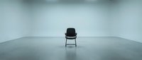 Single black chair with metal frame positioned in center of empty minimalist concrete space, suitable for conceptual business, leadership, and recruitment design projects.