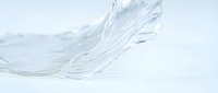 Clear liquid water splash isolated on white background, suitable for cosmetics, skincare, beverage, and wellness product design.