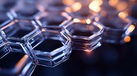 Glowing hexagonal molecular structure with orange light reflections on dark background, representing nanotechnology and scientific innovation in modern research.