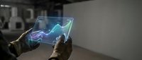 Hands holding transparent tablet displaying holographic financial chart with upward trending arrow in modern office environment for business analytics.
