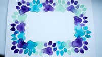 Colorful paw print border frame in blue, purple and teal watercolor style on white background for pet-themed designs and animal lover projects.