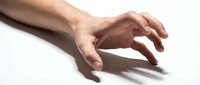 Male hand with medium skin tone reaching downward against white background, suitable for business, healthcare, assistance, and design projects.