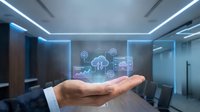 Business professional presenting cloud computing technology with holographic interface in modern conference room for digital transformation solutions.