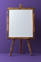 Wooden easel with blank white canvas on purple background, mockup for art presentation and design projects, isolated studio shot with clean composition.