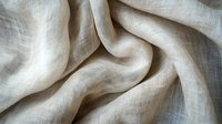 Soft beige linen fabric with natural wrinkles and folds creating gentle waves and shadows, showcasing organic textile texture and delicate weave pattern.