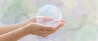 Hands gently holding glowing crystal sphere with magical sparkles on soft watercolor background for wellness and spiritual healing concepts.