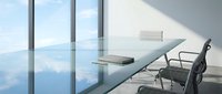Modern office workspace with floor-to-ceiling windows overlooking clouds, minimalist desk, and ergonomic chair for corporate business environments.