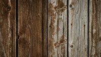 Weathered wooden planks with peeling paint and rustic texture, perfect for vintage backgrounds, farmhouse decor, and country-style design projects.