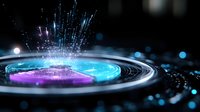 Glowing circular hologram with purple and blue light effects emitting bright particles and energy waves against dark background, futuristic technology concept.