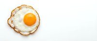 Fried egg with golden yolk on white background, isolated breakfast food for cooking and culinary design projects.