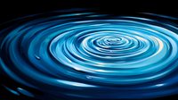 Mesmerizing blue spiral water ripple effect on dark background creates dynamic motion and flow pattern. Suitable for abstract backgrounds and meditation concepts.