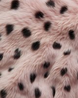 Pink faux fur texture with black spots pattern for fashion design and textile applications in clothing accessories and home decor projects.