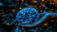 Glowing blue brain hologram floating above open palm against dark background with bokeh lights, representing artificial intelligence and future technology concepts.