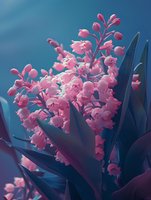 Delicate pink flowers bloom against dark green leaves in dreamy blue light, creating a romantic botanical scene for nature photography.