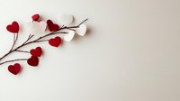 Red and white paper hearts arranged on brown tree branch against neutral background, creating romantic minimalist composition for Valentine's Day or love themes.