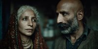 Elderly couple with weathered faces showing deep emotion and life experience in dramatic lighting for storytelling and character development projects.