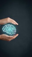 Human hands protecting glowing digital brain with circuit patterns representing artificial intelligence and machine learning technology.