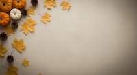 Autumn flat lay with orange pumpkins, golden maple leaves and pine cones on neutral beige background with copy space for seasonal holiday designs.