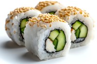 Fresh sushi rolls with cucumber, cream cheese and sesame seeds on white background, close up view of traditional Japanese cuisine rolls.
