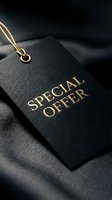 Luxury black price tag with gold foil Special Offer text on dark silk fabric, elegant retail concept for premium fashion promotions.