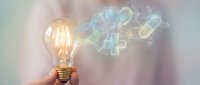 Glowing incandescent bulb emitting colorful digital light waves and data streams, representing innovation, creativity, and technology solutions for business concepts.