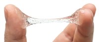 Two fingers holding a transparent gel or liquid bridge stretching between them on white background, demonstrating viscosity and elasticity for skincare, cosmetics, or scientific applications.