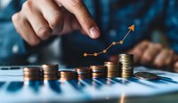 Financial growth concept illustrated with stacked coins and rising orange graph arrow, perfect for business, investment, and economic presentations.