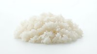 Cooked white rice grains isolated on white background, ready for food and culinary design projects.