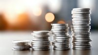 Growing stacks of silver coins arranged in ascending order representing financial growth, savings, investment progress and wealth accumulation concept.
