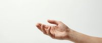 Open palm hand gesture showing receiving or giving motion against clean white background for commercial and design projects.