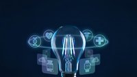 Digital healthcare innovation concept with glowing lightbulb and medical icons on dark blue background for technology presentations.