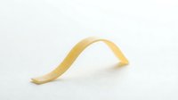 Isolated golden ribbon or decorative tape curved on white background, ready for design projects, packaging mockups, gift wrapping concepts, and creative compositions.