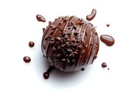Dark chocolate truffle with drizzled ganache and sprinkled cocoa nibs on white background, isolated confectionery with splashes and drops for dessert menu or packaging design.