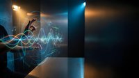 Businessman analyzing financial data with glowing wave graphics and stock market charts, representing digital analytics and investment strategy for business presentations.