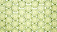 Fresh cucumber slices seamless pattern on light green background. Healthy vegetable texture for food design, spa wellness concepts, kitchen decor projects.